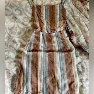 Women’s size XS multi colored mini dress. Ties and zips in the back